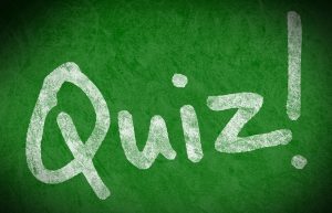 The word Quiz! is written in white on a green background